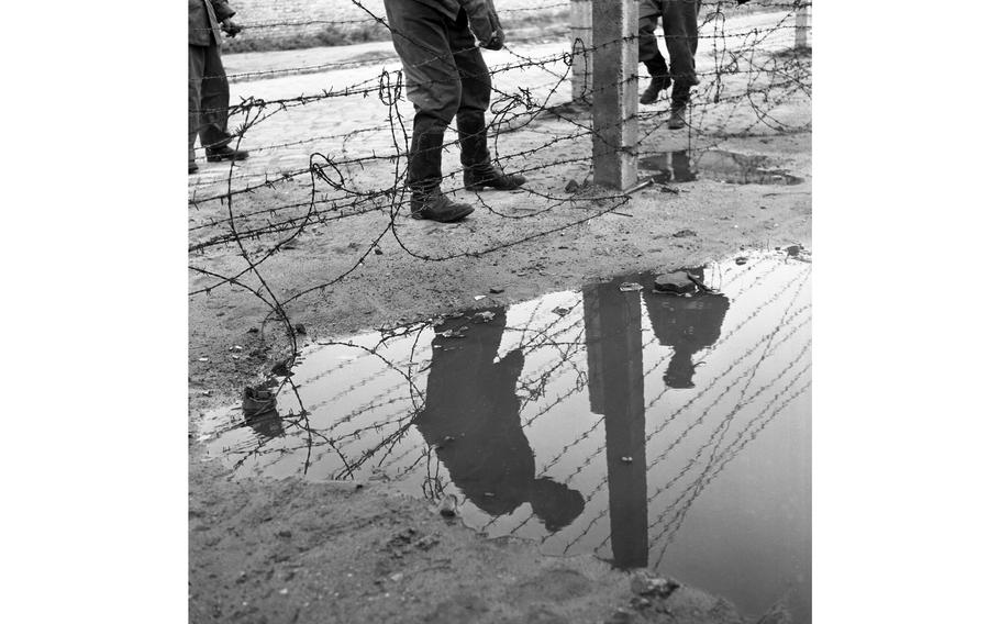 Barbed wire plays an important part in the East Zone Communists’ scheme of things, as demonstrated by those Vops who are laying a strand at the border in Berlin.