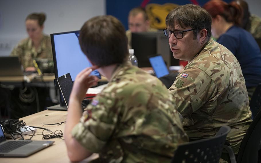 British personnel working at Patch Barracks in Stuttgart, Germany, on June 3, 2022, interact as part of a Ukrainian request for shipment of weapons from Western countries for use in the war against Russia.