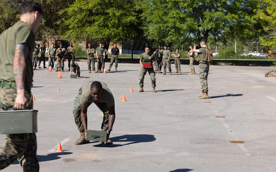 U.S Marines and airmen perform exercises with ammo cans