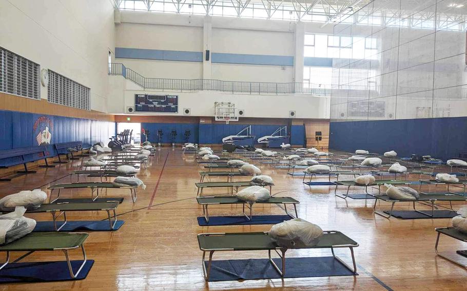 Cots made ready for potential evacuees at the Main Base Fleet Fitness Center at Sasebo Naval Base in Sasebo, Japan, Aug. 8,2023. 