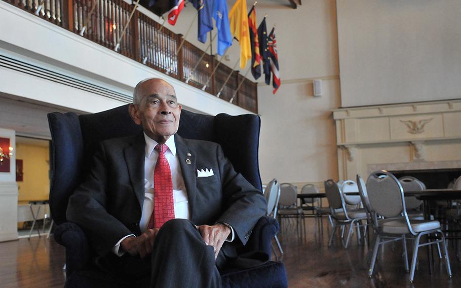 Retired Lt. Gen. Arthur J. Gregg sits in the ballroom of Lee Club at Fort Lee. Behind him on the right above the fireplace mantle once hung a painting of Confederate General Robert E. Lee. The club hosted Gregg’s retirement ceremony in 1981 but could not admit him when he became an officer in 1950. 