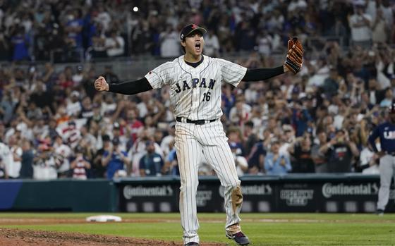 Japan pitcher Shohei Ohtani (16) celebrates after defeating the United States at the World Baseball Classic final game, Tuesday, March 21, 2023, in Miami.