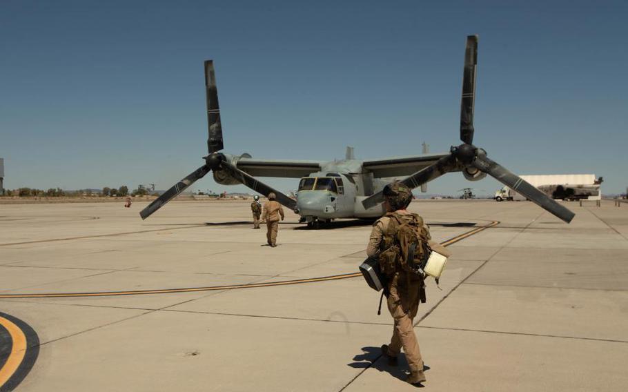 Marines of Marine Aviation Weapons and Tactics Squadron 1 prepare for flight aboard an MV-22B Osprey at Marine Corps Air Station Yuma, Ariz., on April 08, 2022.