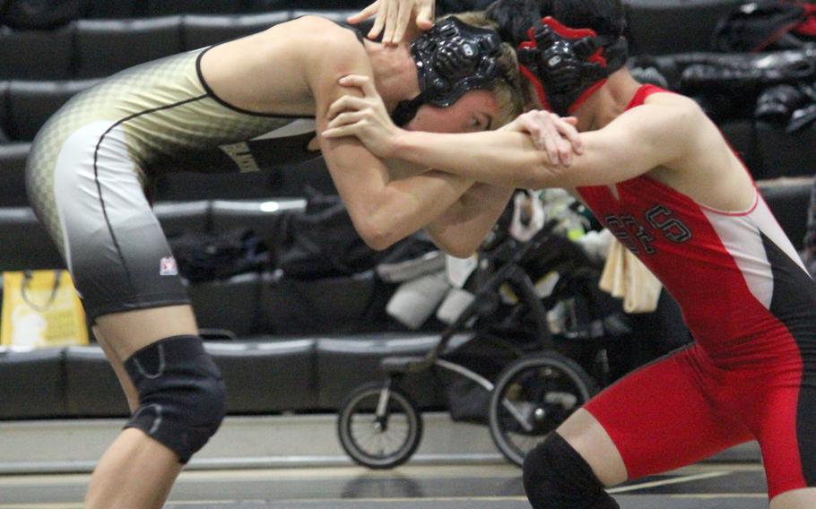 Humphreys' Andrew Wahlgren, left, pinned Seoul Foreign's Sangyun Shin in 1 minute, 40 seconds at 129 pounds during Wednesday's Korea wrestling dual meet. The Blackhawks routed the Crusaders 57-4.