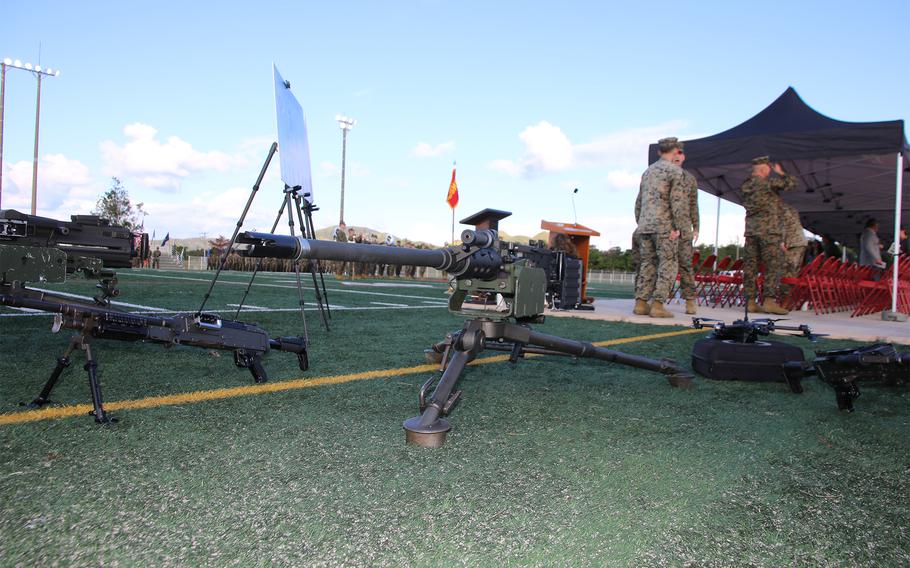 Machine guns and drones are on display during a redesignation ceremony launching the new 12th Marine Littoral Regiment at Camp Hansen, Okinawa, Wednesday, Nov. 15, 2023.