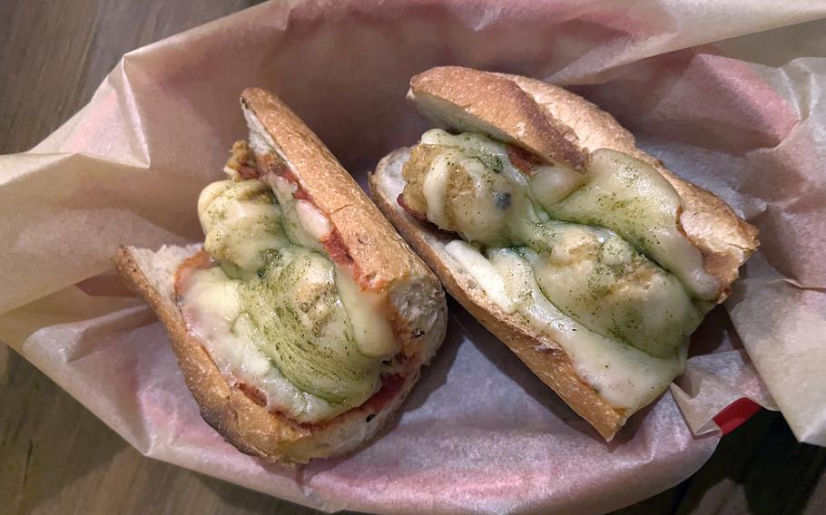 The vegetarian meatball hero from Harry’s Sandwich Company in Tokyo features vegetarian meatballs, marinara sauce and mozzarella cheese.