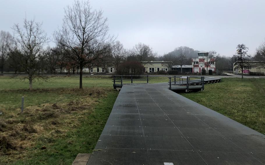 Former airfield buildings are seen in the background at Alter Flugplatz in Frankfurt on Dec. 18, 2023.