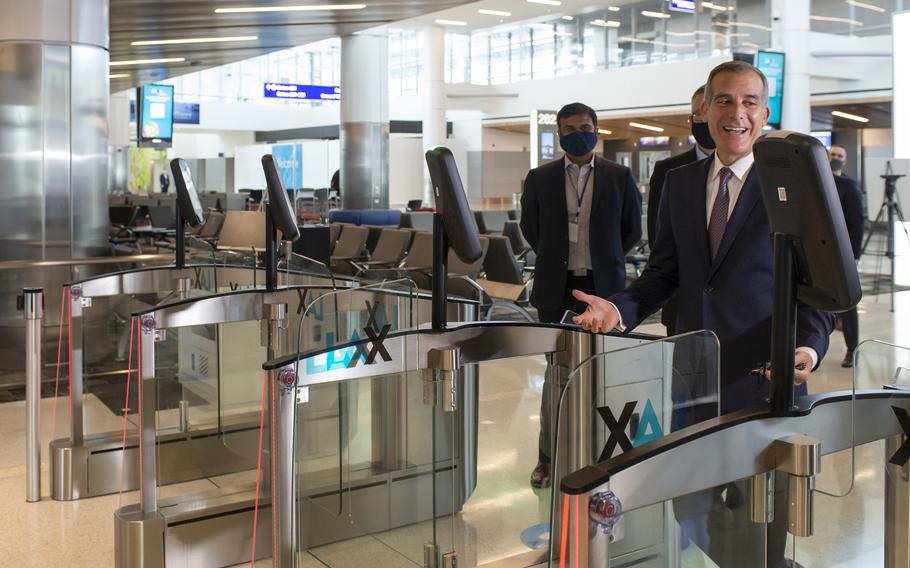 Los Angeles Mayor Eric Garcetti tries the new biometric boarding gates at Los Angeles International Airport, part of the airport’s digital transformation initiative.