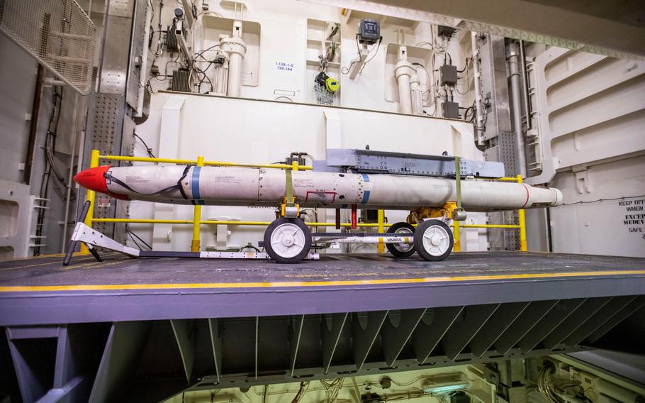 Missiles sit on the electromagnetic weapons elevator in the hangar bay aboard the USS Gerald R. Ford on Thursday, Oct. 6, 2022. The elevator is one of the new pieces of technology on the ship that streamlines the weapons-moving process and cuts down on time.