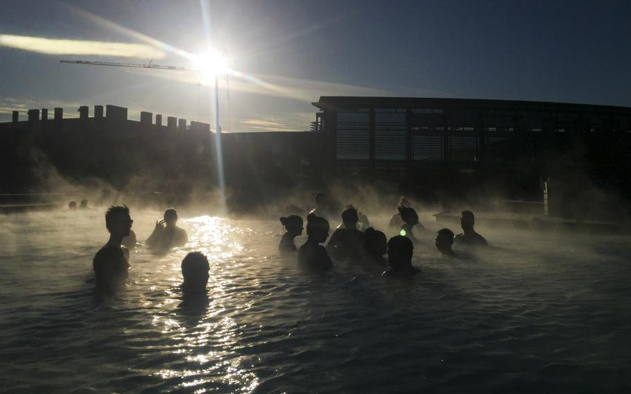 People relax in the Blue Lagoon, a geothermal spa that’s the most visited attraction in the country, in Grindavik, Iceland, in 2016.