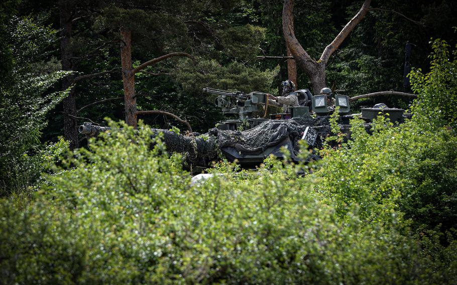 An M1 Abrams crew navigates through a wooded area during Exercise Combined Resolve 17 at the Joint Multinational Readiness Center in Hohenfels, Germany, June 8, 2022. Combined Resolve is a U.S. Army exercise involving 5,600 U.S. service members, allies, and partners from more than 10 countries.