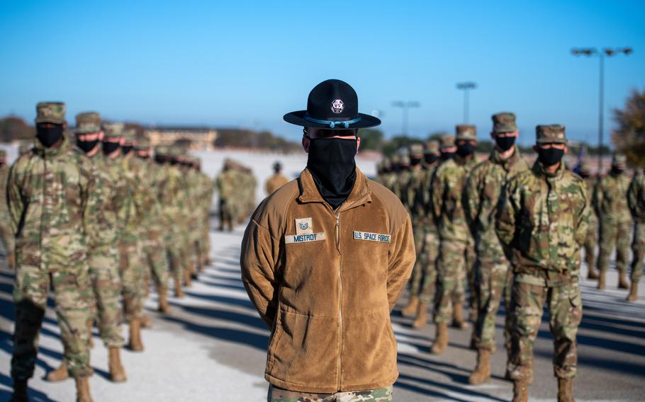 U.S. Space Force Tech. Sgt. Eric Mistrot, 324th Training Squadron military training instructor, stands in front of his flight during the graduation ceremony, Dec. 10, 2020, at Joint Base San Antonio-Lackland, Texas. Seven members of the graduating class are the first Space Force trainees to graduate. The number of Space Force trainees will continue to increase over time as processes for recruiting and training are solidified. The first full flight of Space Force trainees is anticipated to graduate in February 2021. Approximately 312 Space Force accessions will graduate from BMT this fiscal year. Currently all Space Force accessions will become Space Systems Operations specialist. (U.S. Air Force photo by Sarayuth Pinthong)