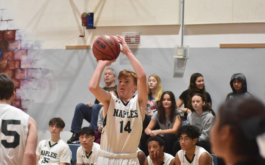 Naples' Camden Kasparek puts up a three-point shot attempt Saturday, Jan. 7, 2023, in the Wildcats' 56-50 loss to Aviano.