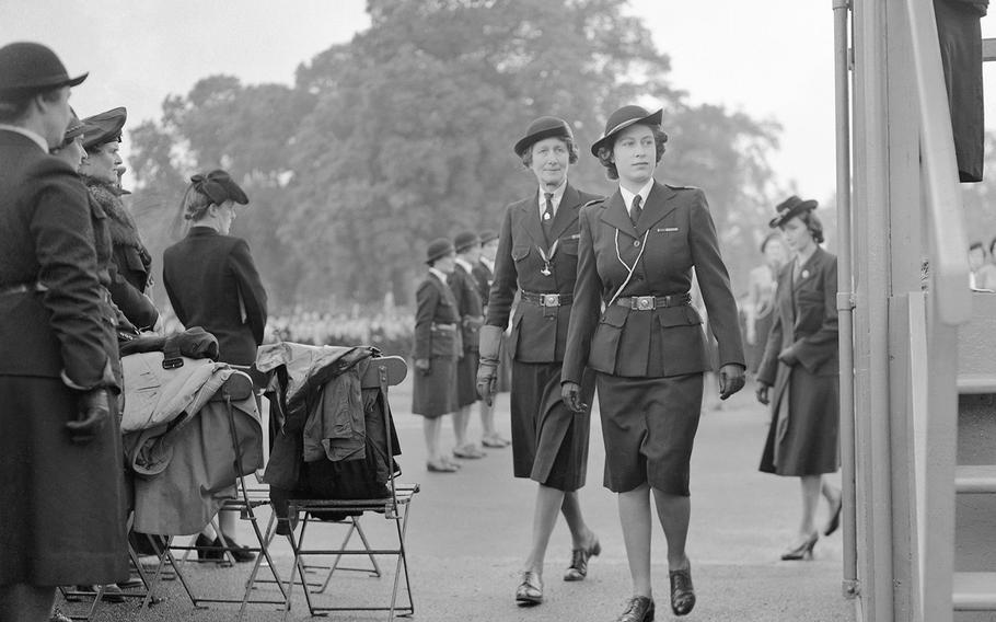 Then-Princess Elizabeth makes her way to saluting base where she will watch the march past of some of the eight thousand Girl Guides on parade in Hyde Park, London, on May 19, 1946. 