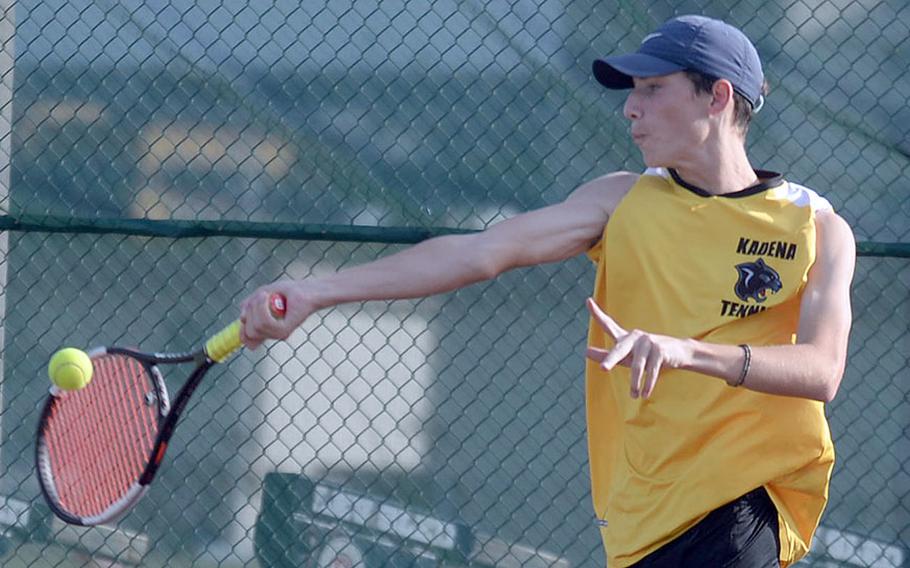 Kadena's Evan Davis hits a forehand return during Wednesday's Okinawa tennis doubles tournament. Davis and partner Justin Saavedra beat Kubasaki's Owen Ruksc and Jaden Oshana 8-6 to win the championship.