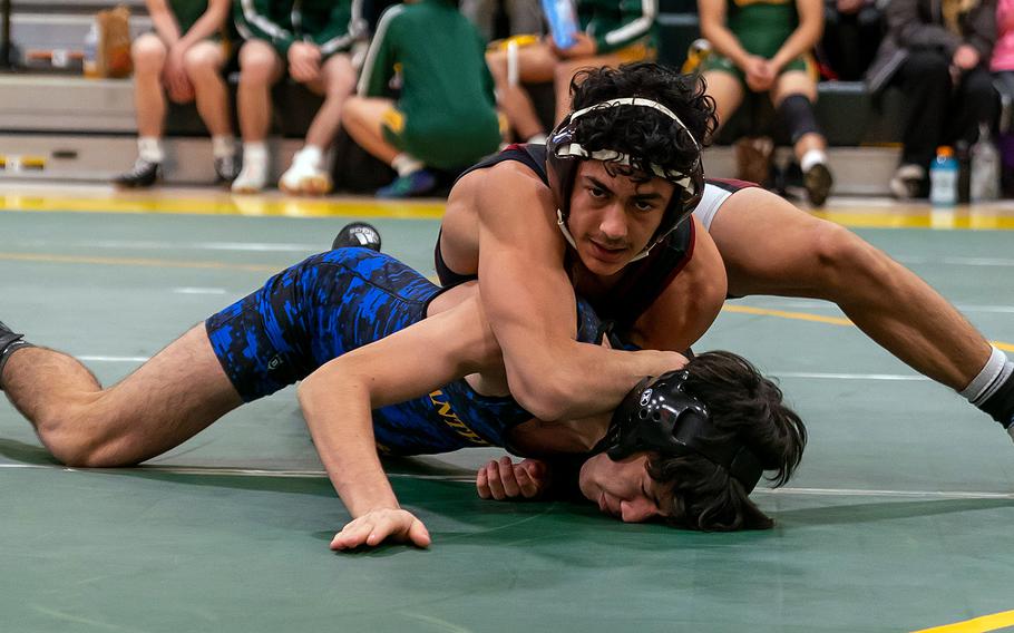 Zama's Gabriel Escalera gets the early advantage on Yokota's Kai Patton during Saturday's DODEA-Japan wrestling tri-meet. Patton rallied to pin Escalera and the Panthers won the meet 30-25.