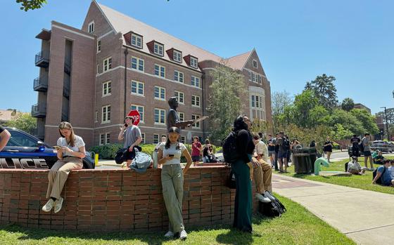 Florida State University students wait for news amid an active shooter incident at the school’s campus in Tallahassee, Fla., Thursday, April 17, 2025 (AP Photo/Kate Payne)
