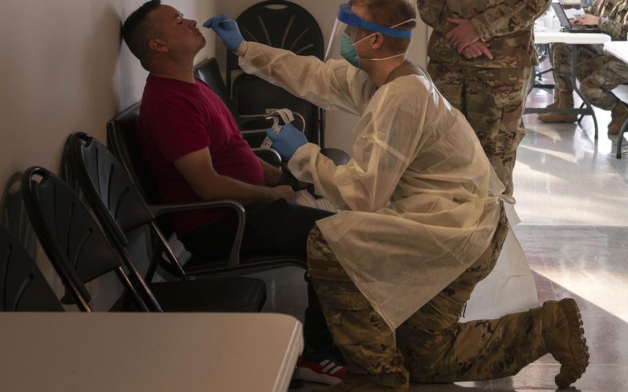 Staff Sgt. Travis Chadwick, 187th Aeromedical Evacuation Squadron, tests a passenger at Baltimore Washington International Thurgood Marshall Airport, Nov. 9, 2020. Beginning July 15, 2021, onsite COVID-19 testing services will be discontinued for Patriot Express flights out of BWI and Seattle-Tacoma International Airport, Wash. 