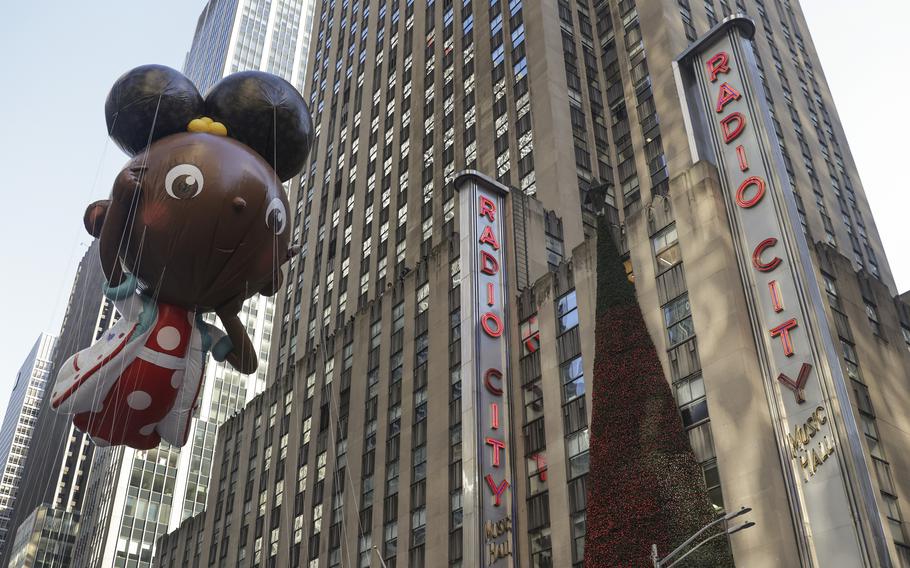 The Ada Twist, Scientist balloon floats past Radio City Music Hall during the Macy’s Thanksgiving Day Parade, Thursday, Nov. 24, 2022, in New York. 