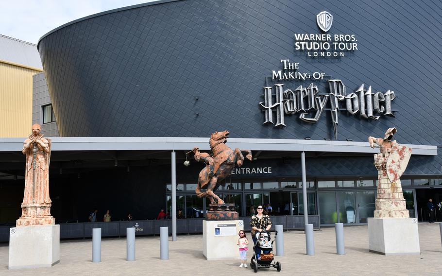 My wife, daughter and son stand outside the entrance to the Warner Bros. studio tour The Making of Harry Potter. 