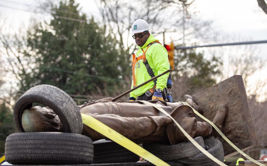 Henry stands over a statue of Confederate Gen. A.P. Hill after it was removed from its pedestal in Richmond on Dec. 12. It was the last major Confederate statue to be removed from the city.