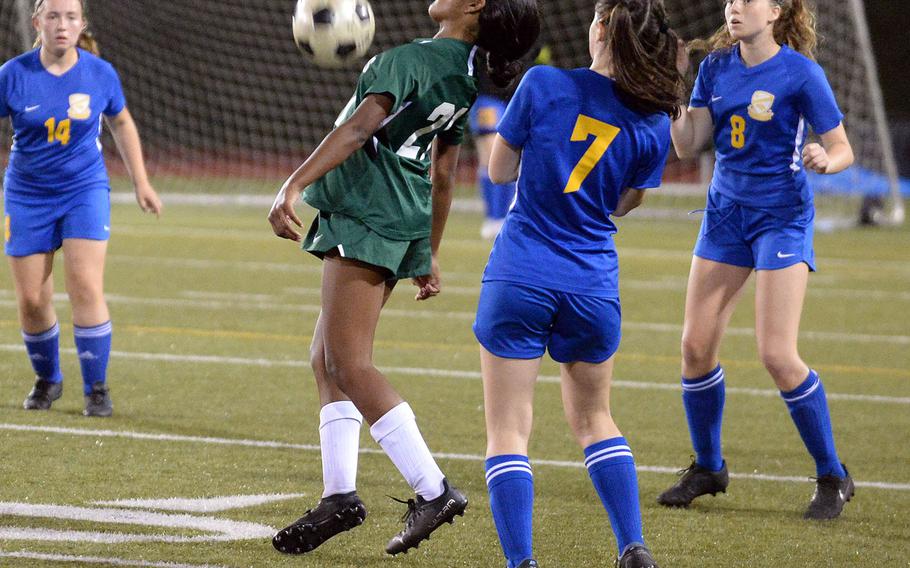 Kubasaki's Solares Solano steadies the ball between Yokota defenders Kaci McBrayer, Annie Mitchell and Lucy  Reese during Saturday's All-DODEA-Japan girls soccer tournament final.