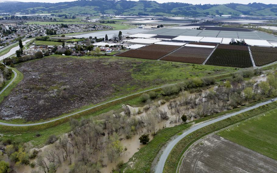 This photo provided by the California Strawberry Commission shows a flooded Pajaro River area in Pajaro, Calif., on Tuesday, March 14, 2023. California’s strawberry farms have been hit hard by this year’s winter storms.