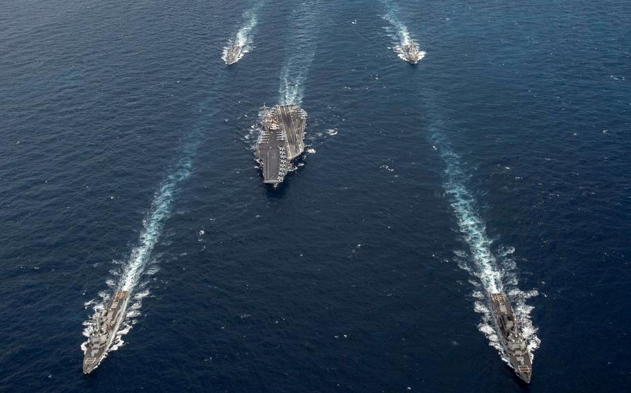 Ships from the George H.W. Bush Carrier Strike Group transit the Atlantic Ocean in March 2022. The ships passed the Strait of Gibraltar and entered the Mediterranean Sea as part of a deployment in the U.S. Naval Forces Europe-Africa area of operations, Aug. 25, 2022.