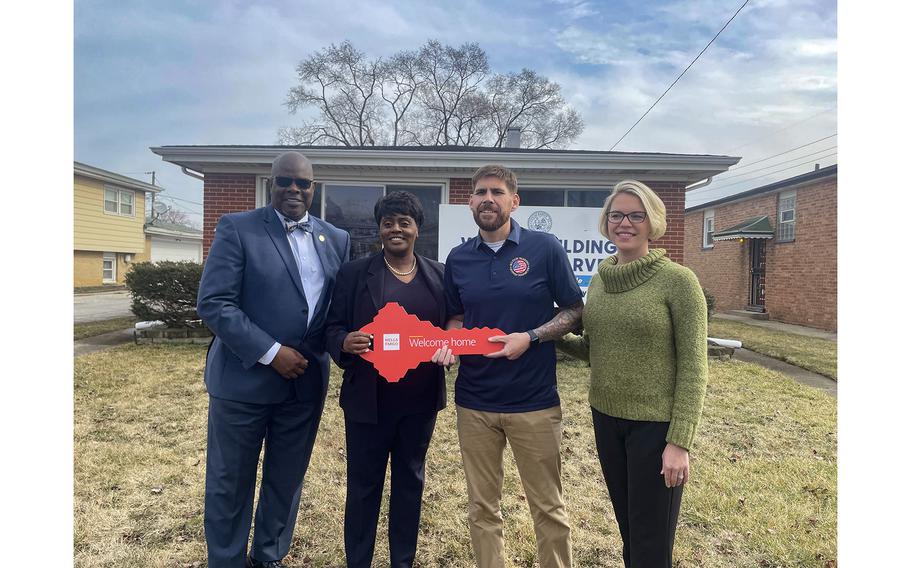 Harvey Mayor Christopher Clark, from left, Kenya VanOsten-Promin from Wells Fargo Bank, Purple Heart veteran Manuel Cebrebos and Casey Kinser with Military Warriors Support Foundation are seen Thursday, Feb. 22, 2024, 