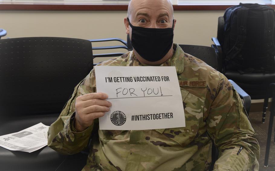 Master Sgt. Michael Buchholz, 155th Maintenance Group Quality Assurance, holds a sign that read “I’m getting vaccinated for you!” Five governors sent a letter Tuesday to Defense Secretary Lloyd Austin to request he withdraw a directive that National Guard troops must be vaccinated against the coronavirus. 