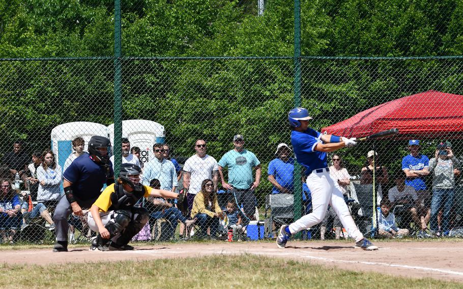 Ramstein Royals senior CJ Delp hits a line drive single to left field driving in a run during the Division I title game in the 2022 DODEA-Europe baseball championships.