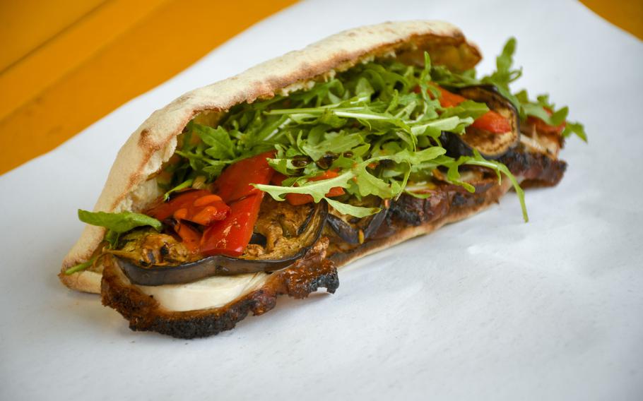 JaMaMaSi offers sandwiches such as this one, which heaps porchetta, arugula, garlic confit, roasted vegetables and pepper flakes on fresh bread. 