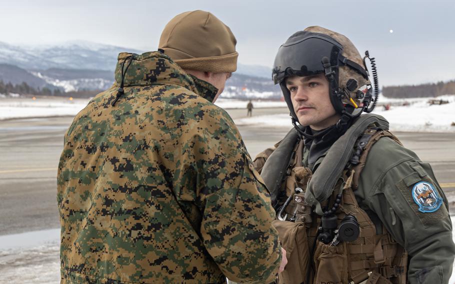 Marine Corps Commandant Gen. David H. Berger receives a unit patch from Sgt. Andre Doss during Exercise Cold Response 2022, Bardufoss Air Station, Norway, March 22, 2022. Doss is a crew chief assigned to Marine Medium Tiltrotor Squadron 261.