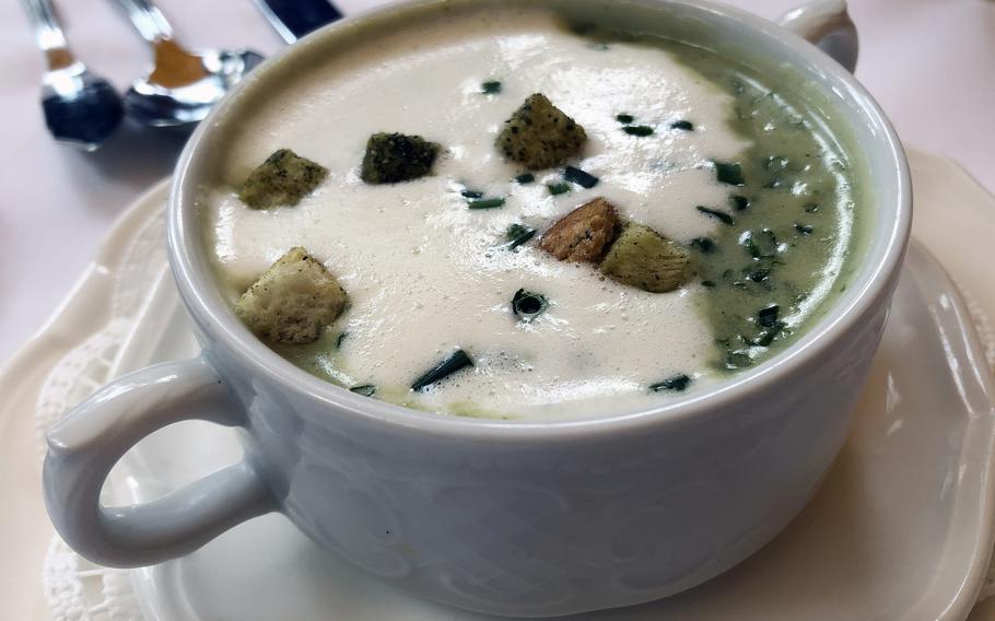 The Wiesenkräuterschaumsüppchen, or meadow herb foam soup, a soup as the name implies, flavored with  herbs and served with croutons at the Forsthaus Rheinblick in Wiesbaden, Germany.