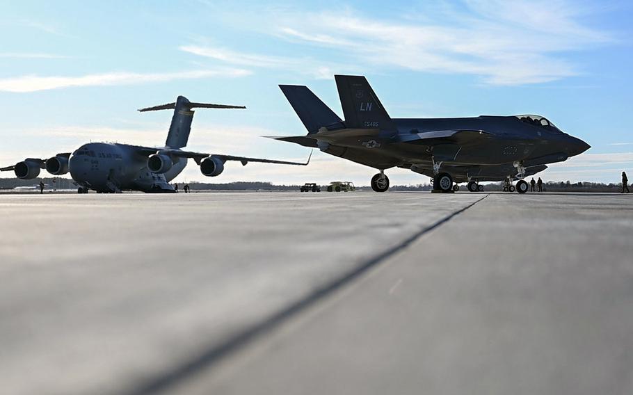 A U.S. Air Force C-17 Globemaster III from Hickam Air Force Base, Hawaii and an F-35 Lightning II from RAF Lakenheath, England, are parked on the airfield at Ämari Air Base, Estonia, Feb. 27, 2022.