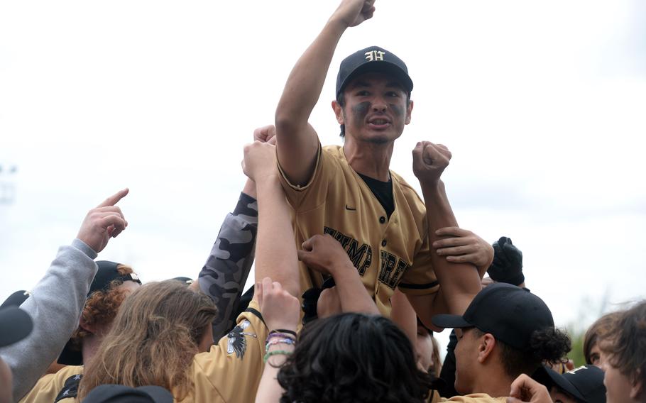 Humphreys’ Justin Taft is hoisted onto the shoulders of his Blackhawks teammates after they beat Osan 6-2 for the DODEA-Korea district baseball title.