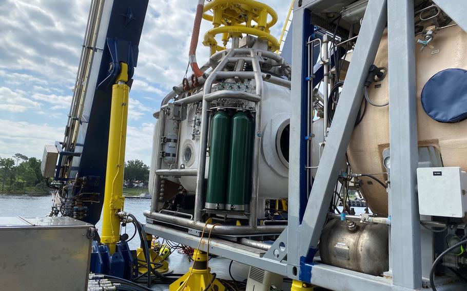 The diving bell, left, and habitat, right, for the mission, as seen in September in Panama City, Fla. 