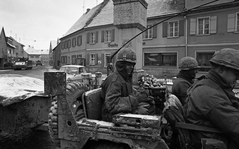 Infantry troops taking part in the Carbide Ice exercise roll through the village of Koenigstein in the Vilseck-Grafenwoehr area.