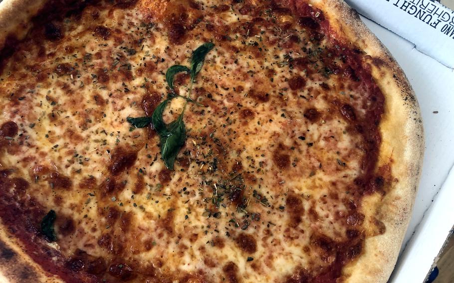 The Margherita pizza at Villa Italiano, near Kleber Kaserne in Kaiserslautern, Germany, is topped with fresh basil and oregano.