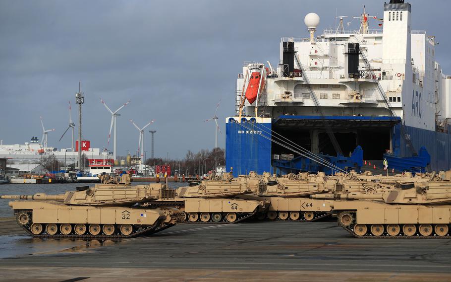 A platoon of M1 Abrams battle tanks, manufactured by General Dynamics Land Systems, sits next to the Endurance vehicle carrier during the U.S.-led NATO Defender Europe-20 Exercise at the Port of Bremerhaven in Bremerhaven, Germany, on Feb. 21, 2020.