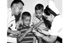 Frankfurt, Germany, August, 1955: With his six-year-old brother Ronald watching, seven-year-old Robert Duran, son of Sgt. and Mrs. Raymond Duran, receives a Salk polio vaccine shot from Capt. Anna L. O'Hagen at the 97th General Hospital. Helping out is Sgt. Lester Nelson. The Salk vaccine, approved for release to the general public four months earlier, was a large factor in controlling a disease that struck over 57,000 Americans in 1952. By 1962, with the Sabin vaccine added to the fight, the number of new cases reported was under 1,000.
Want more of Stars and Stripes’ historic content? Subscribe to Stars and Stripes’ historic newspaper archive! We have digitized our 1948-1999 European and Pacific editions, as well as several of our WWII editions and made them available online through https://starsandstripes.newspaperarchive.com/
META TAGS: pandemic, polio eradication, humanitarian aid, U.S. Air Force, U.S. Army, military medical