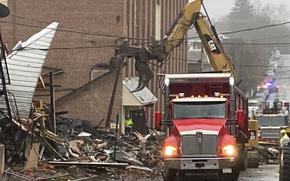 Rubble is cleared at the site of a deadly explosion at a chocolate factory in West Reading, Pa., Saturday, March 25, 2023. (AP Photo/Michael Rubinkam)