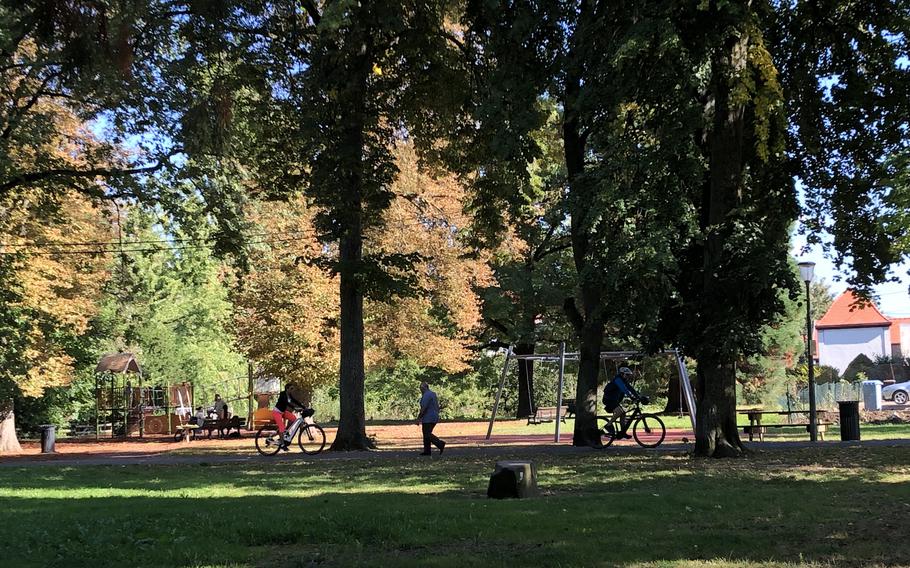 A city park in Wissembourg, France, has a playground and walking paths.