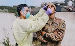An Army medic assigned to 1st Battalion, 503rd Infantry Regiment, 173rd Airborne Brigade, swabs a soldier for COVID-19 at Hohenfels Training Area, Germany, Aug. 20, 2020. Long before vaccines were available, the 173rd Airborne Brigade deployed thousands of paratroopers for a six-week exercise in Germany without suffering a single case by testing all participants before deploying, during the exercise and a third time before redeploying.
