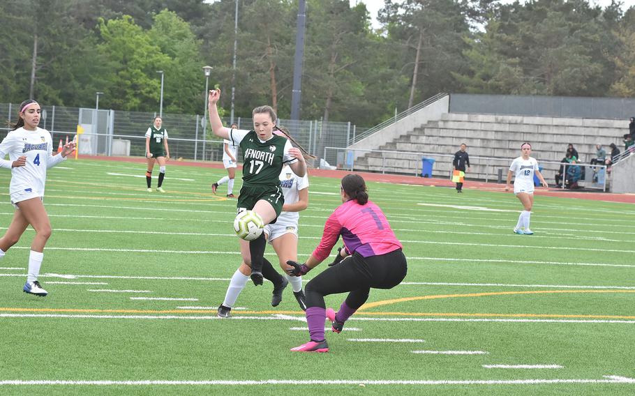 AFNORTH's Isabella Guest gets the ball past Sigonella goalkeeper Laney Reardon , but couldn't convert in the Jaguars' 3-0 victory over the Lions on Tuesday, May 16, 2023, in the Division III girls championships at Ramstein Air Base, Germany.