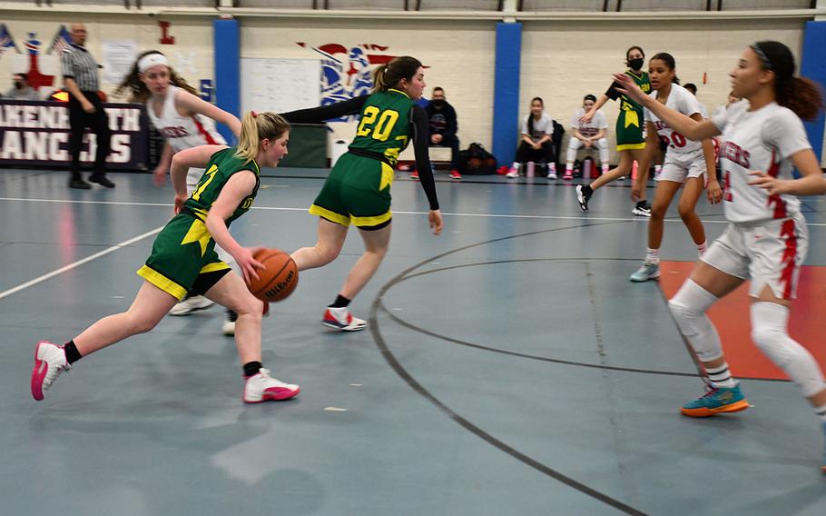 Alconbury's Kennedy Liddell drives into the Lakenheath defense in a girls basketball game between the two schools on Tuesday, Jan. 18, 2022.