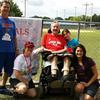 Darrell Lee, 72, center, was diagnosed with amyotrophic lateral sclerosis (ALS) in 2009. For the past several years, the Winter Garden resident has been cared for with the help of the James A. Haley Veterans’ Hospital in Tampa, his daughter Ashley Lee, right, and his granddaughter, Kaylei Lee, second from right. The Lees were at an ALS event several years ago. (Courtesy of Ashley Lee/TNS)