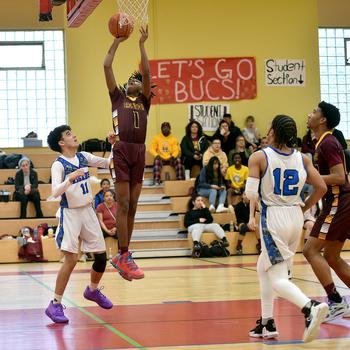 Baumholder's Leo Kirkland goes up for the layup after a steal on Saturday after at the Hall of Champions Fitness Center in Baumholder, Germany. Brussels' Isaiah Rivera, left, tries to defend, while Rivera's teammate Damick Rogers, right, follows.