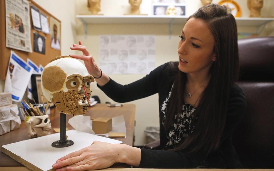 Samantha Molnar, a forensic artist for Attorney General's Bureau of Criminal Investigation, works on the early stages of a Jane Doe in March 2018.