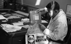 Ramstein, Germany, November 25, 1970. Warren T. Lee, AFTV news director, receives the first load of Stateside news film. AFTV will be showing Stateside TV news film for the first time, and less than 24 hours after it has been seen on TV in the United States. The new service, arranged by USAFE with the American Broadcasting Company, brings film aired on the 6 p.m. (EST) news in the States to be screened the next evening on the AFTV broadcasts.
META TAGS: Europe; Armed Forces Network; American Forces Network; AFN; television; broadcast;  ABC News; ABC